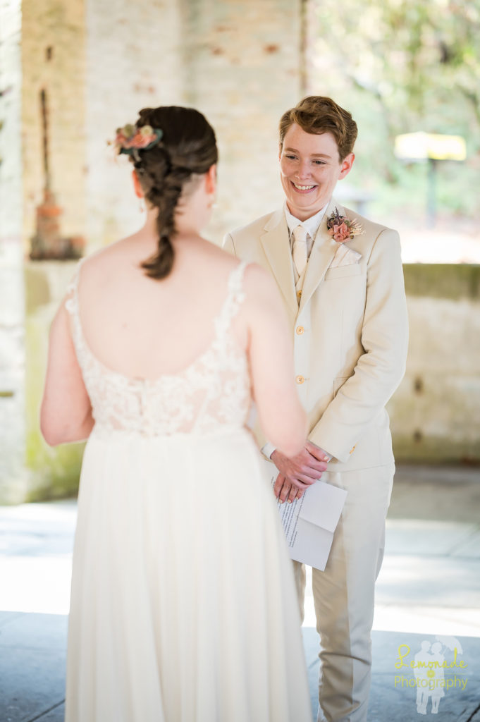 Couple smiling during ceremony at Manchester State park wedding