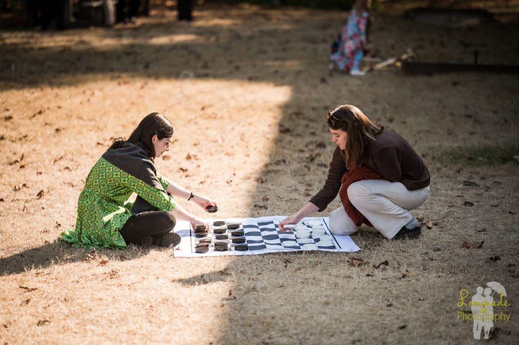 Guests playing checkers at Manchester State park wedding