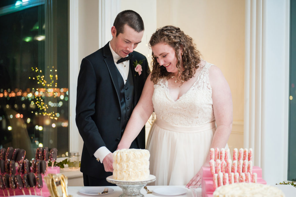 Bride and groom cutting cake at Union Club Tacoma wedding